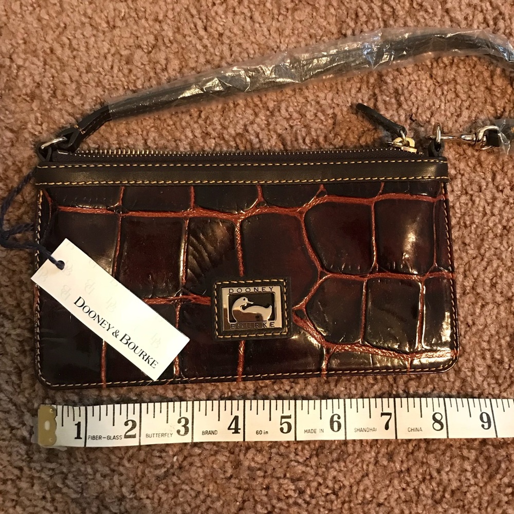 Never used Dooney&Bourke large slim wristlet